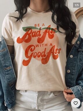 Next Level Apparel Cream Tee with Orange Retro Script